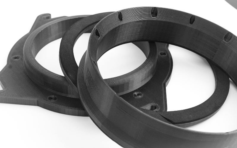 FDM 3D printed parts showing layer lines and precision finish