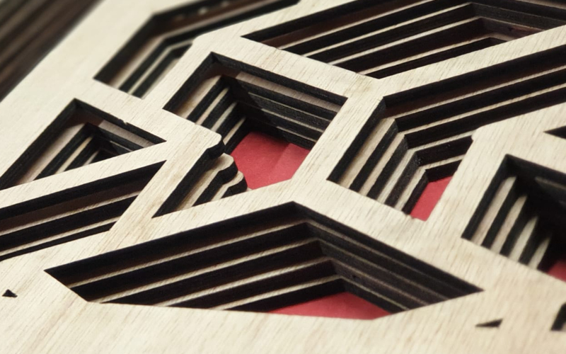 Precision laser cut wooden panels with geometric patterns