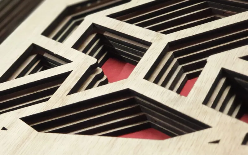 Precision laser cut wooden panels with geometric patterns